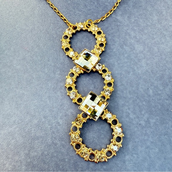 Belladonna Circular Crystal and Gold Tone Infinity Pendant Necklace - Picture 15 of 17